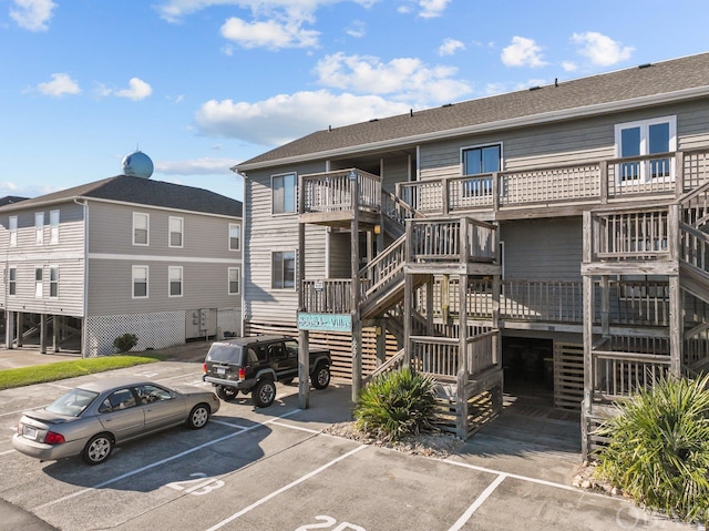 view of property featuring uncovered parking