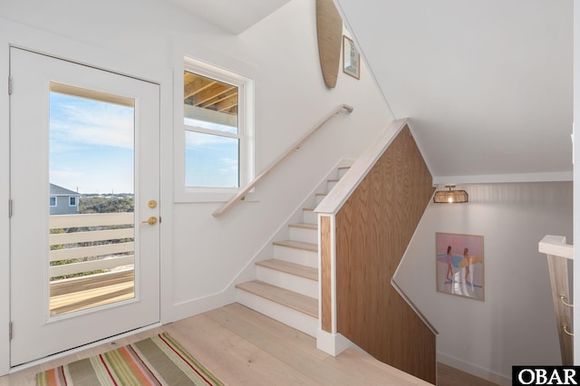 staircase with wood finished floors