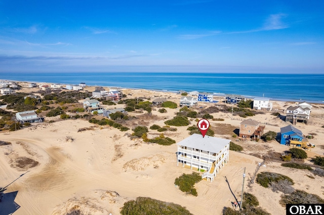 aerial view with a beach view and a water view