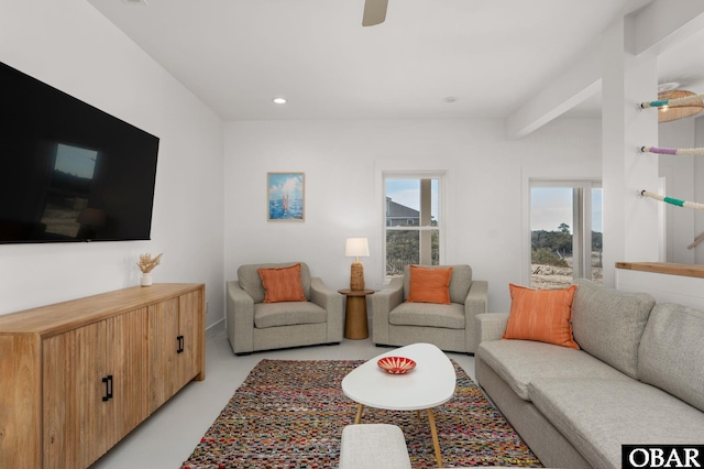 living area with recessed lighting and ceiling fan