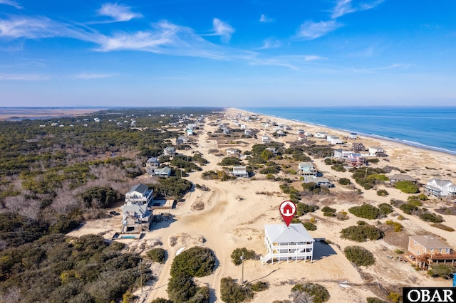 drone / aerial view featuring a view of the beach and a water view