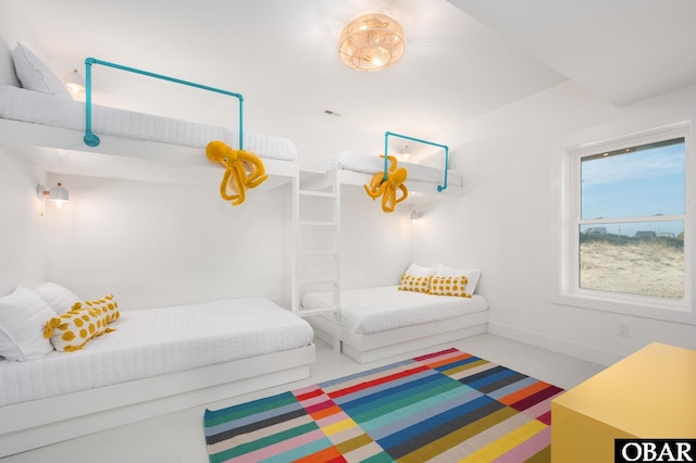 bedroom featuring visible vents and baseboards