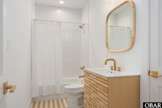 bathroom featuring recessed lighting, shower / bath combination with curtain, toilet, and vanity