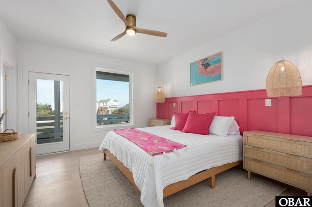 bedroom with access to exterior, light wood-style flooring, and ceiling fan