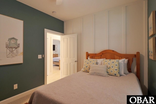 bedroom featuring carpet floors, baseboards, and a ceiling fan