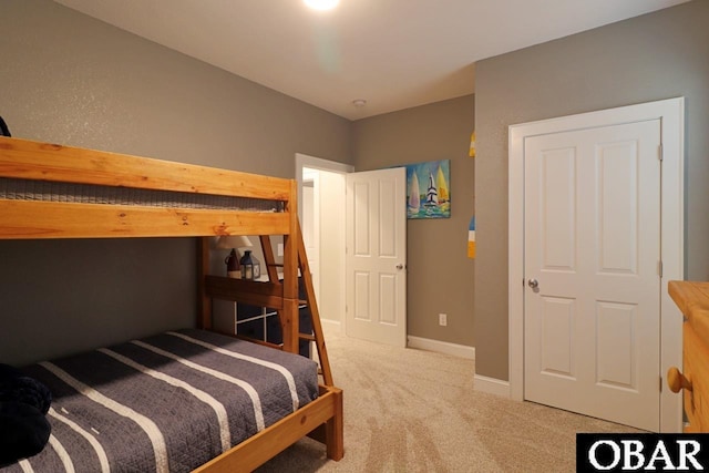 carpeted bedroom with baseboards