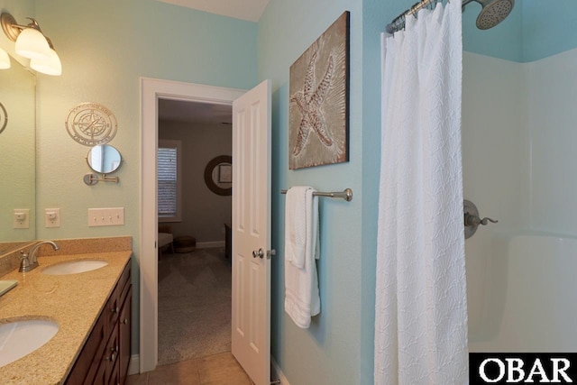 full bathroom featuring tile patterned floors, a sink, a shower with curtain, and double vanity