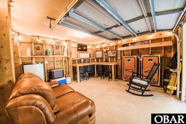 living area with a garage and concrete floors