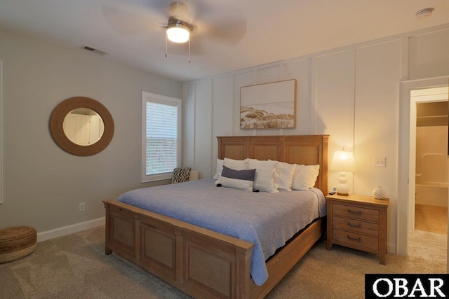 bedroom featuring light carpet, a ceiling fan, visible vents, and baseboards