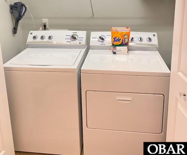 laundry room featuring laundry area and washer and clothes dryer