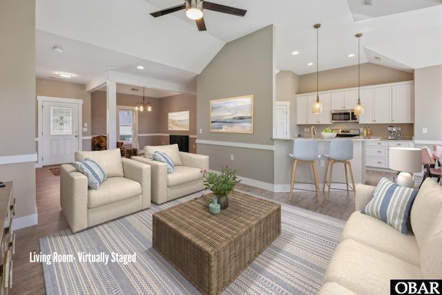 149 Carolina Club Dr Lot 54, Grandy, NC 27939 - living room featuring vaulted ceiling, light wood-style flooring, a ceiling fan, a chandelier, and recessed lighting