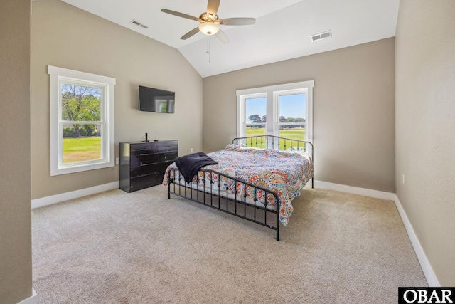 149 Carolina Club Dr Lot 54, Grandy, NC 27939 - bedroom with multiple windows, vaulted ceiling, carpet flooring, and a ceiling fan