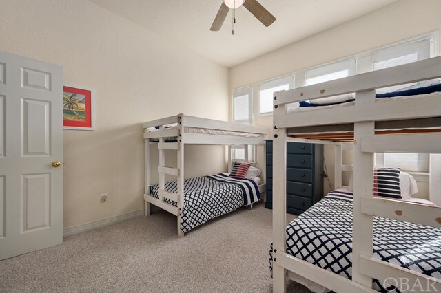 carpeted bedroom with baseboards