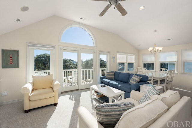 carpeted living area with lofted ceiling and visible vents