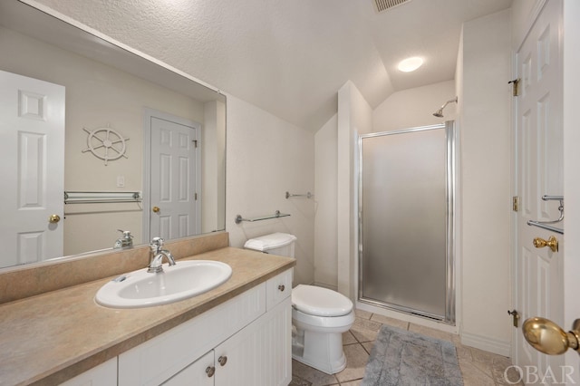 bathroom featuring lofted ceiling, toilet, a shower stall, vanity, and tile patterned floors