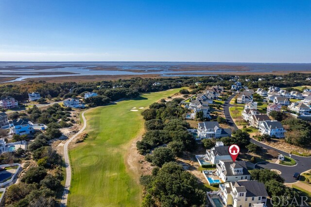 bird's eye view with a residential view, a water view, and golf course view