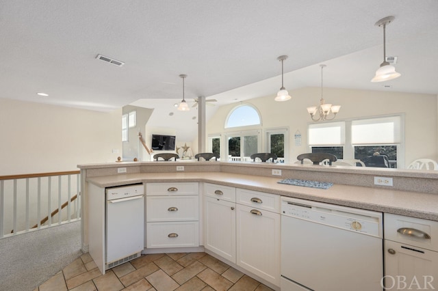 kitchen featuring open floor plan, light countertops, dishwasher, and visible vents