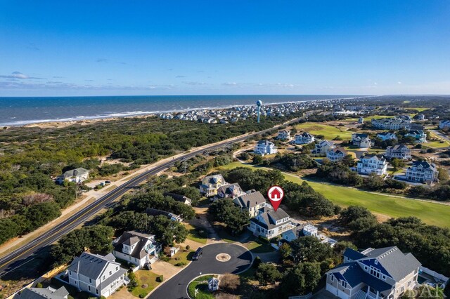 bird's eye view featuring a water view and a residential view