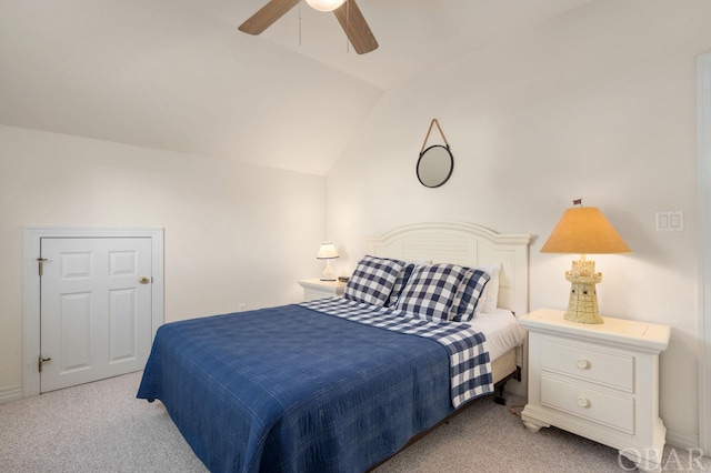 bedroom featuring lofted ceiling, ceiling fan, and light colored carpet