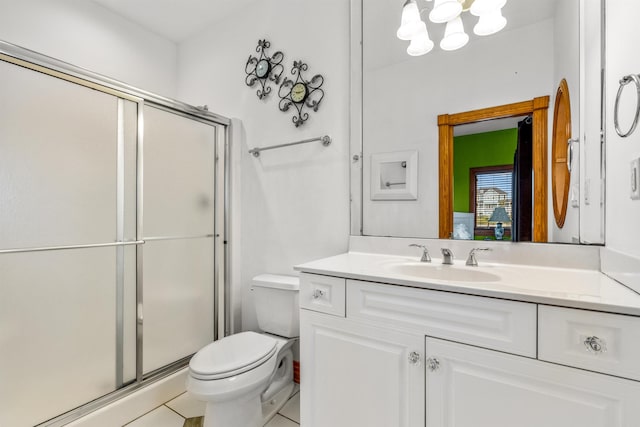 670 Hunt Club Dr Lot 194, Corolla, NC 27927 - bathroom featuring a stall shower, vanity, toilet, and a chandelier