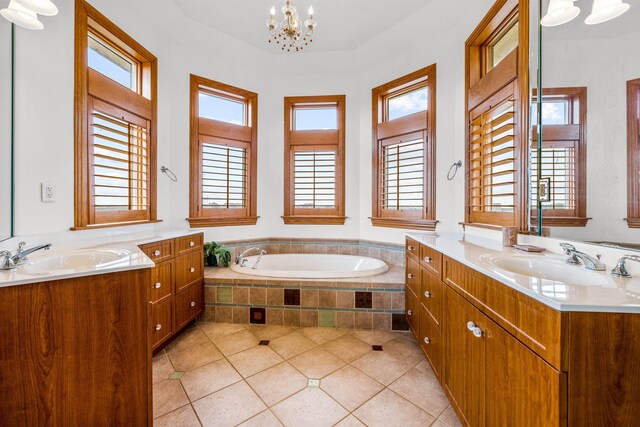 670 Hunt Club Dr Lot 194, Corolla, NC 27927 - full bathroom with tile patterned flooring, a chandelier, two vanities, and plenty of natural light