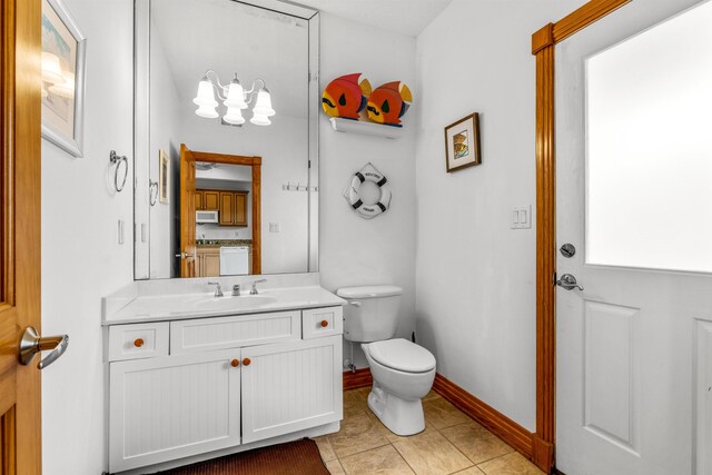 670 Hunt Club Dr Lot 194, Corolla, NC 27927 - bathroom featuring toilet, vanity, tile patterned flooring, and baseboards