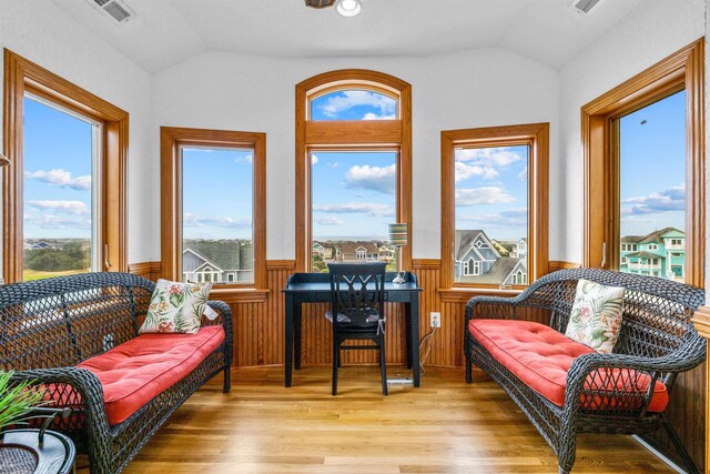 670 Hunt Club Dr Lot 194, Corolla, NC 27927 - sunroom / solarium featuring lofted ceiling, a wainscoted wall, and wood finished floors