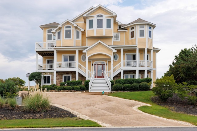 670 Hunt Club Dr Lot 194, Corolla, NC 27927 - view of front of home featuring stairs, a porch, and a balcony