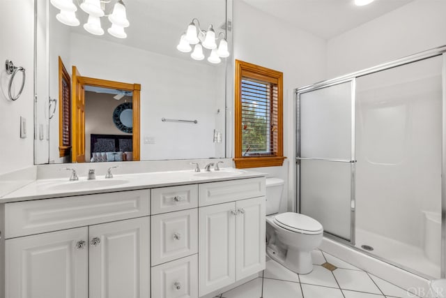 full bathroom featuring a stall shower, a sink, and connected bathroom
