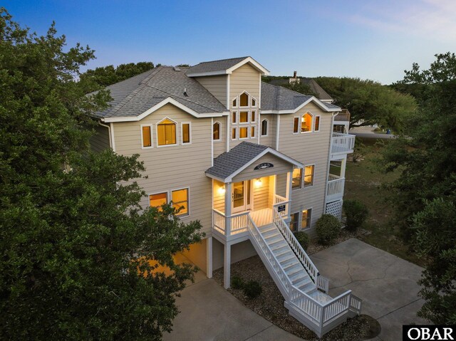 1367 Duck Rd Lot 21, Duck, NC 27949 - coastal home with a balcony, covered porch, stairs, and a shingled roof