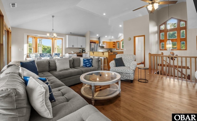 1367 Duck Rd Lot 21, Duck, NC 27949 - living area featuring wood finished floors, high vaulted ceiling, a ceiling fan, and a chandelier