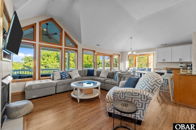 1367 Duck Rd Lot 21, Duck, NC 27949 - living area featuring a chandelier, high vaulted ceiling, and light wood-type flooring