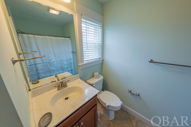 bathroom featuring baseboards, toilet, curtained shower, tile patterned flooring, and vanity