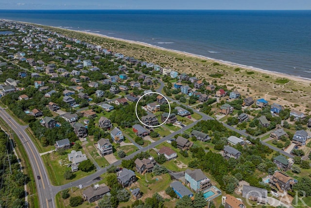 bird's eye view featuring a water view, a residential view, and a beach view