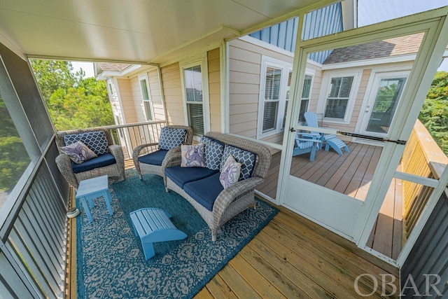 wooden terrace with an outdoor hangout area