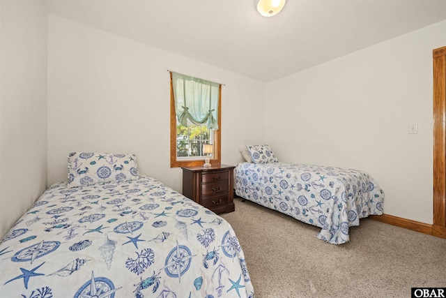 bedroom featuring carpet flooring and baseboards