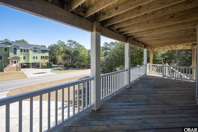 wooden deck featuring a residential view