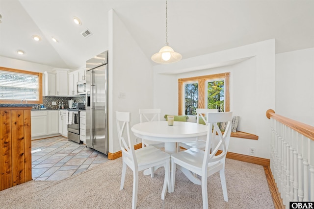 dining area featuring lofted ceiling, visible vents, baseboards, and recessed lighting