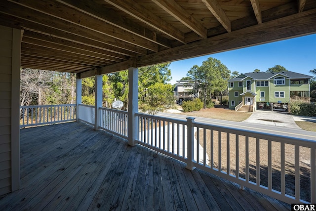 wooden terrace featuring a residential view