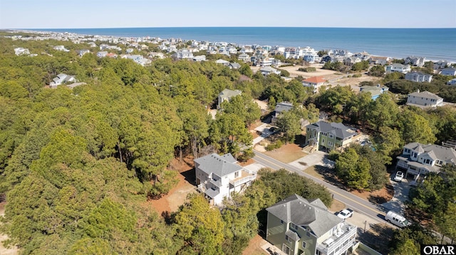 birds eye view of property with a water view and a residential view