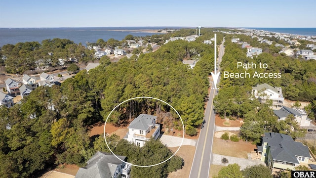 bird's eye view featuring a residential view and a water view