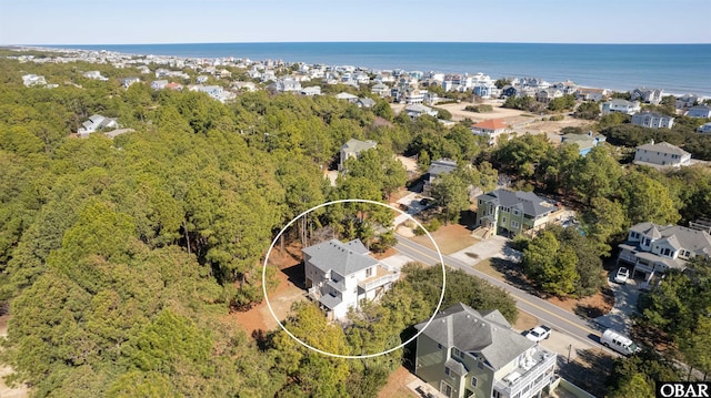 drone / aerial view featuring a water view and a residential view