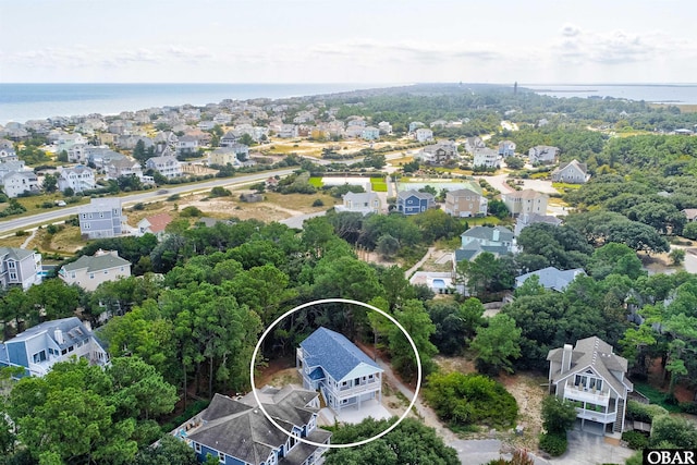 bird's eye view featuring a water view and a residential view