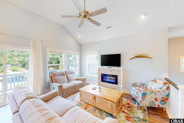 living room with a fireplace, recessed lighting, visible vents, ceiling fan, and wood finished floors