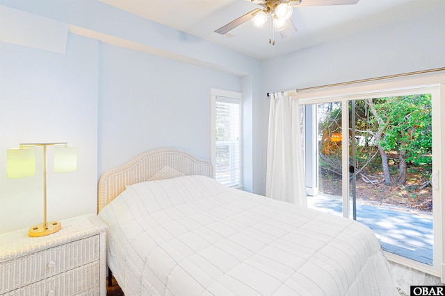 bedroom with access to outside and a ceiling fan