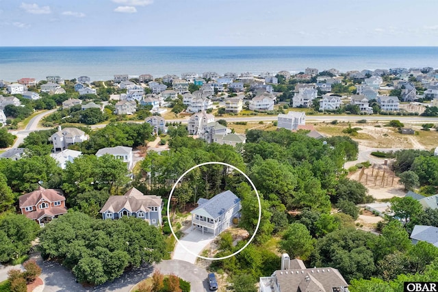 birds eye view of property featuring a residential view and a water view