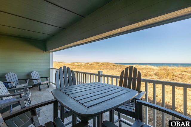 balcony with outdoor dining space and a patio