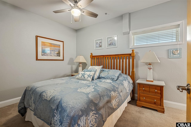 bedroom with light carpet, ceiling fan, and baseboards