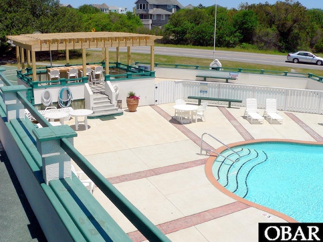 914 Sea Ridge Dr Lot 62, Corolla, NC 27927 - community pool featuring a patio and a pergola