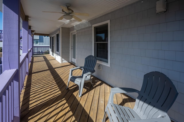 wooden deck with ceiling fan
